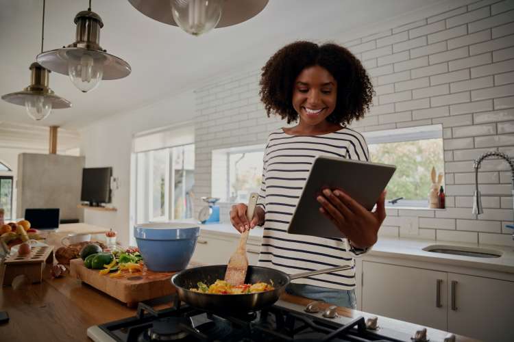 woman taking an online team building cooking class