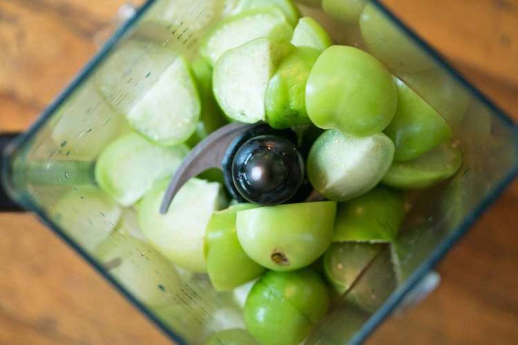 Tomatillos in a blender for making salsa verde