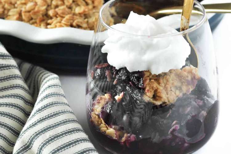 blueberry limoncello crisp with whipped coconut milk is a delicious and cozy vegan gluten free dessert 