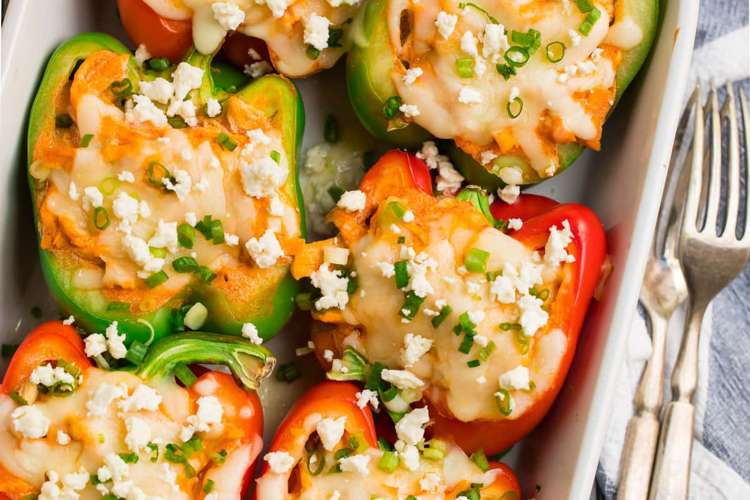 buffalo chicken stuffed peppers are a cheesy, spicy keto lunch idea