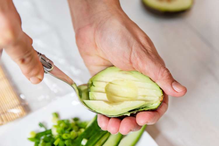 private chef slicing an avocado