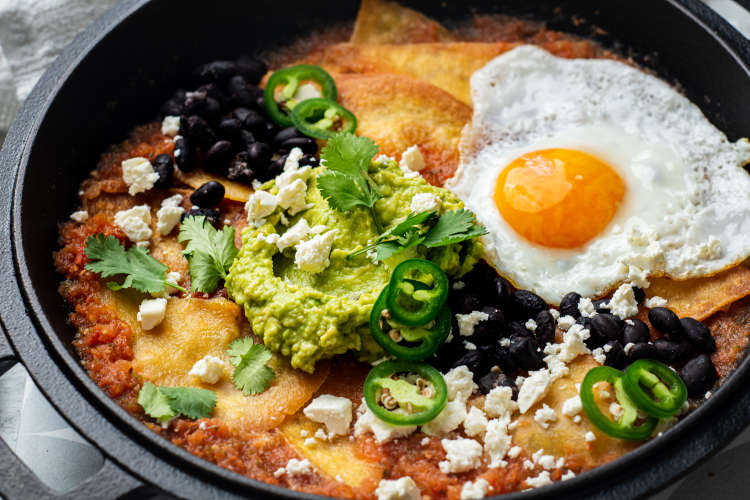 chilaquiles rojos is a mexican side dish that can be enjoyed at any time of the day