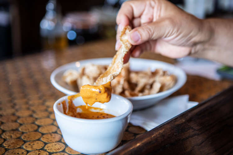 guest on a food tour enjoying appetizers