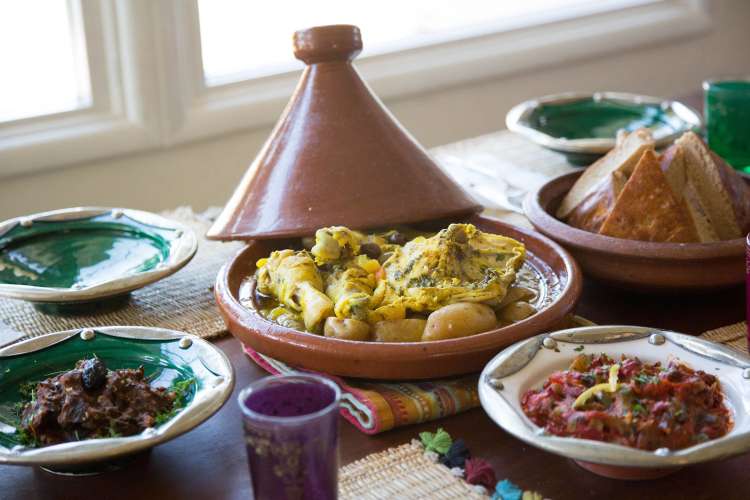 Various meals in clay pots and plates