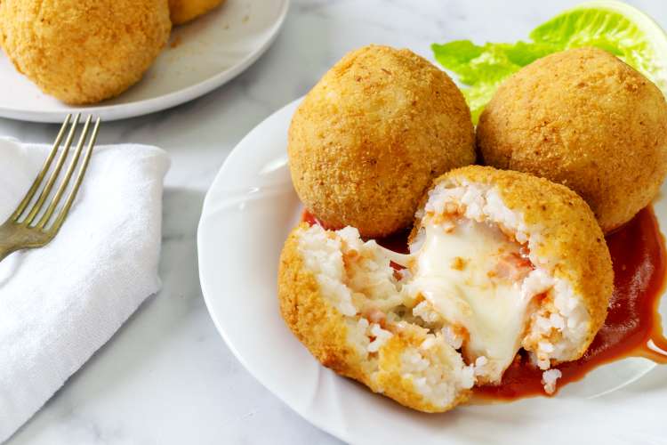 italian rice balls are a meaty, cheesy and crispy easy super bowl appetizer