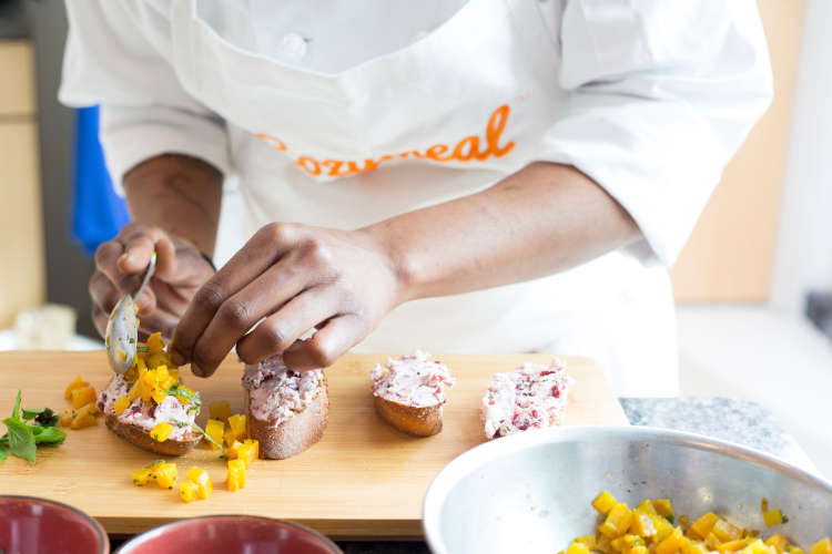 chef preparing crostini in a cooking class