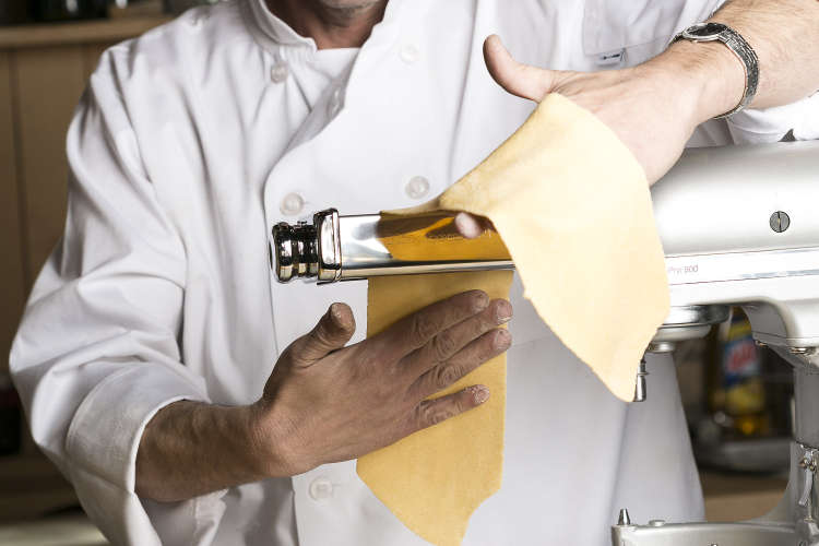 private chef using pasta roller attachment