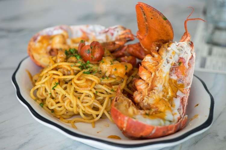 A seafood and noodle meal from a restaurant in San Diego, one of the best foodie cities to visit