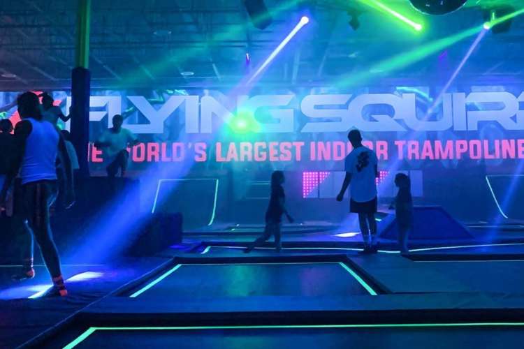 a colorful, neon-lit trampoline park