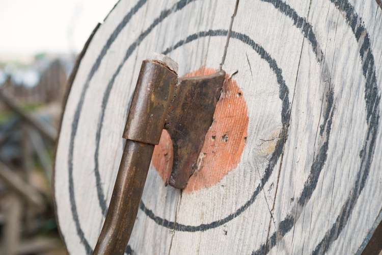 an axe in a wooden target