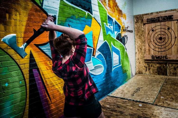 Axe throwing is a wildly fun team building activity in Ottawa.