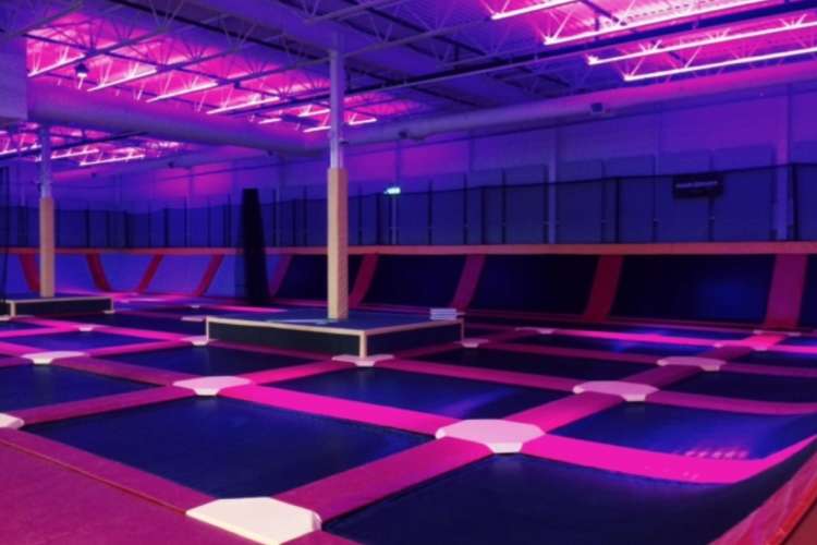 a neon-lit trampoline park