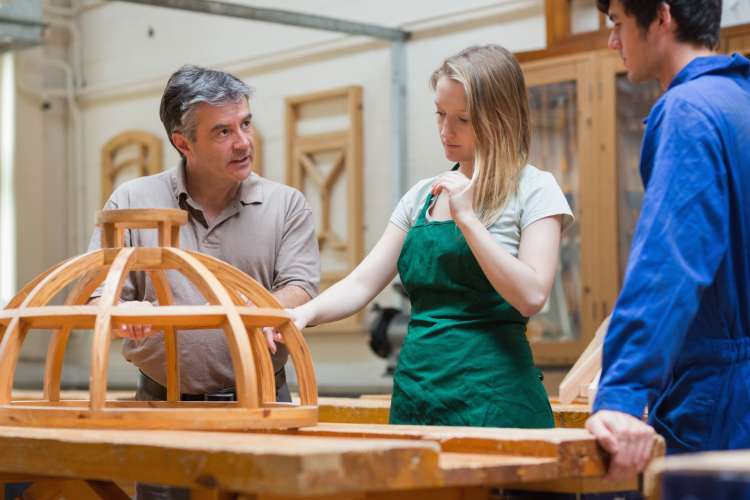 woodworking instructor speaking to students