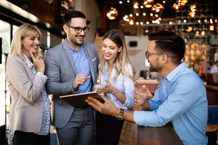 happy employees discussing an idea at work