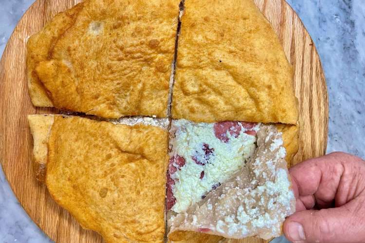 a pizza made with fried dough