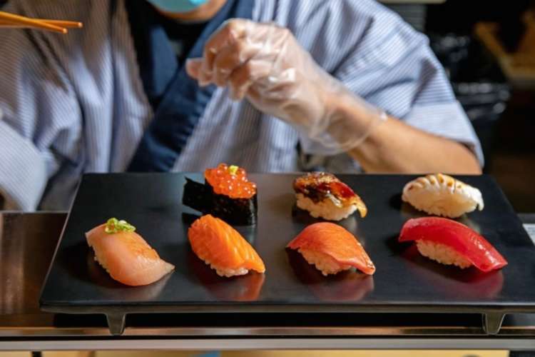 a chef preparing omakase style sushi