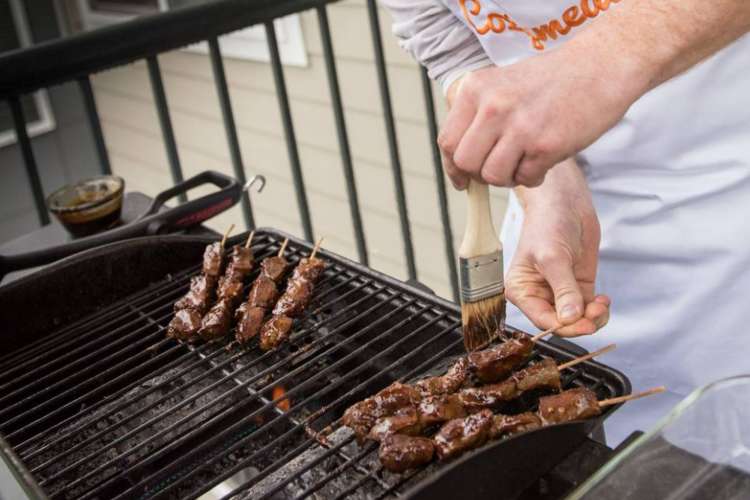 a chef cooking kebabs