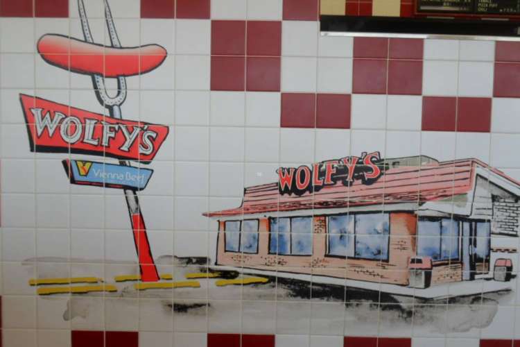 Wolfy's serves famous Chicago hot dogs.