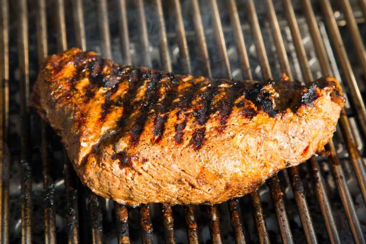 steak on a hot barbecue grill