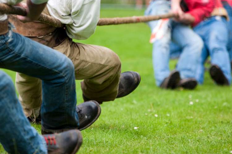 Tug-of-war is a fun company picnic game for cooler days.