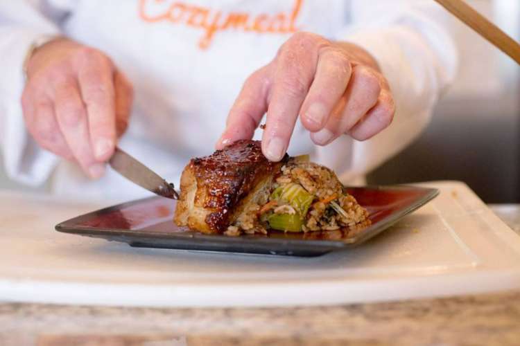 a chef preparing meat