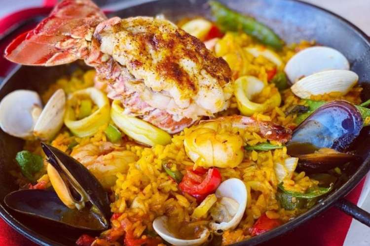 a heaping plate of Cuban rice and seafood