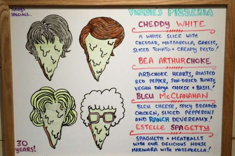 a specials board of Golden Girls-themed pizzas