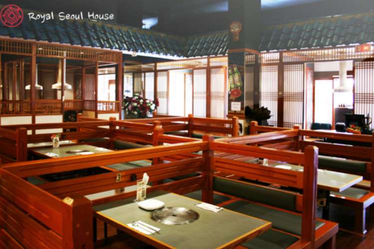 a traditional Korean restaurant interior with wooden decor