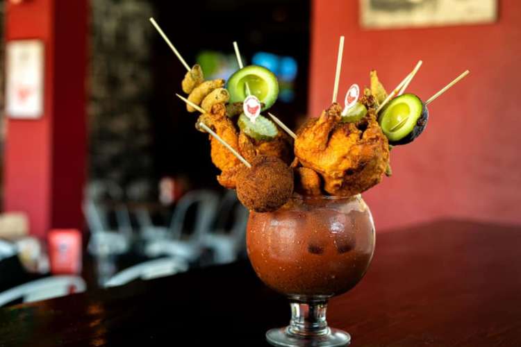 a bloody mary with hot chicken and scotch egg