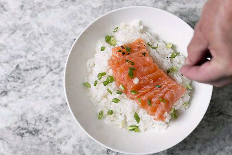 private chef plating salmon and rice