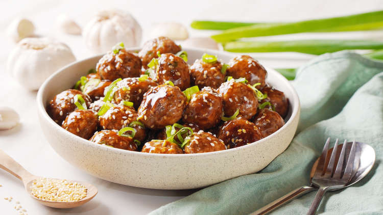 this spicy meatball recipe is an easy super bowl appetizer with an asian flair