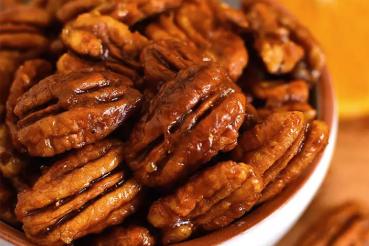 orange candied pecans are spiced and bright