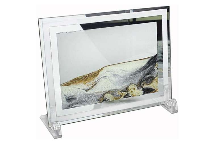 a sand art picture frame made from glass and sand