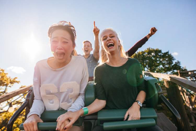 riding the roller coasters at the amusement park