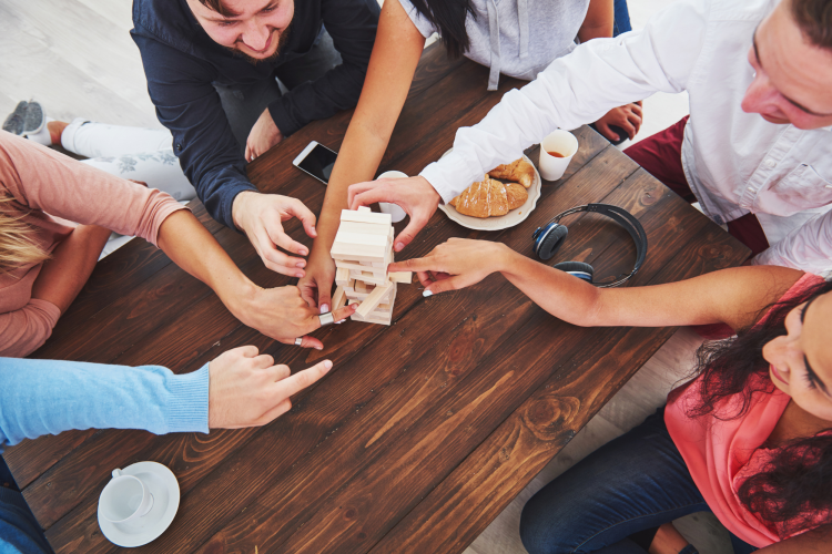 Aerial view of coworkers playing Jenga during a team building in Los Angeles