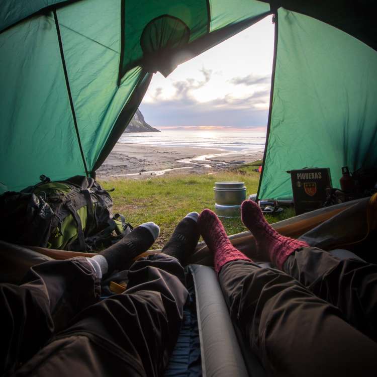 couple spending time in a tent during a weekend camping trip