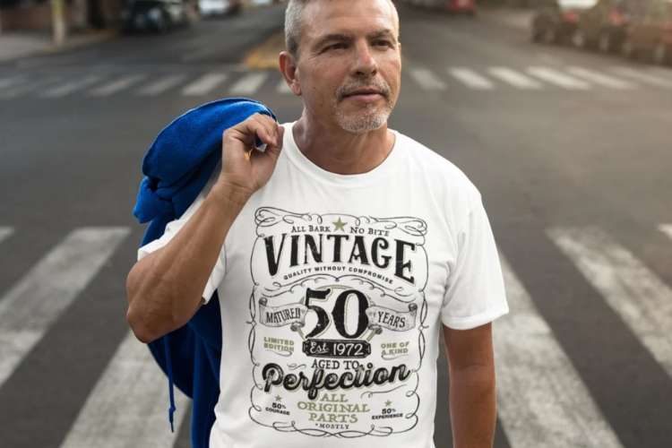 man wearing a vintage 50-year-old whiskey style t-shirt