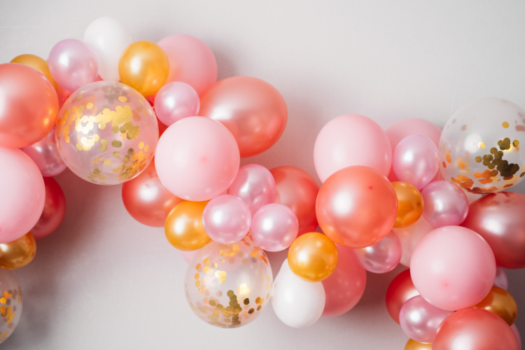 pink and gold ballons making a garland