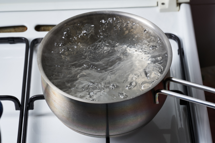 Royalty-Free photo: Boiling water on gray stainless steel cooking pot