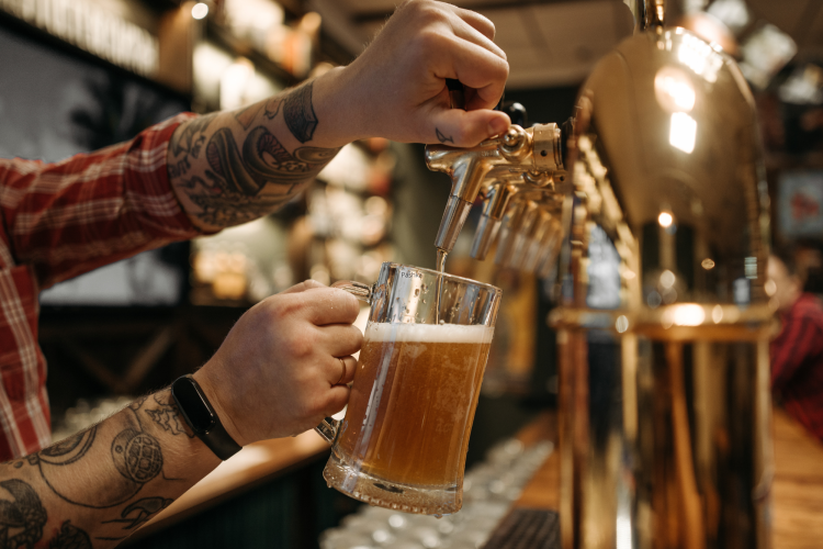 pouring a craft beer at a brewery