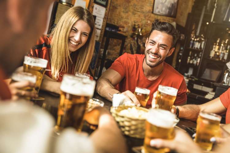 couple enjoying beers at a brewery