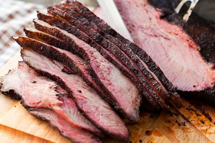 brisket sliced on a cutting board