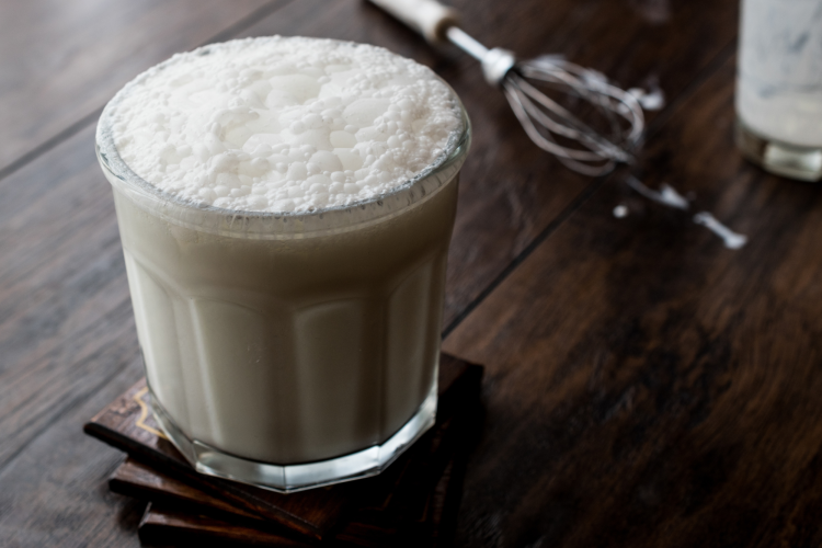 glass of buttermilk on a coaster