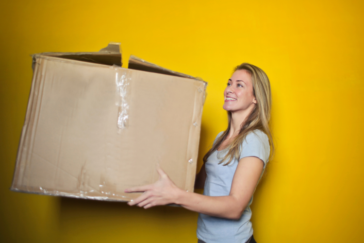 woman holding a cardboard box