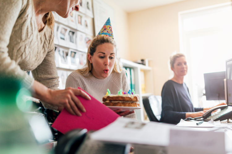 coworkers celebrating a birthday at work