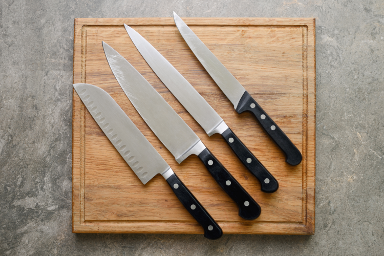 chef's knives on cutting board