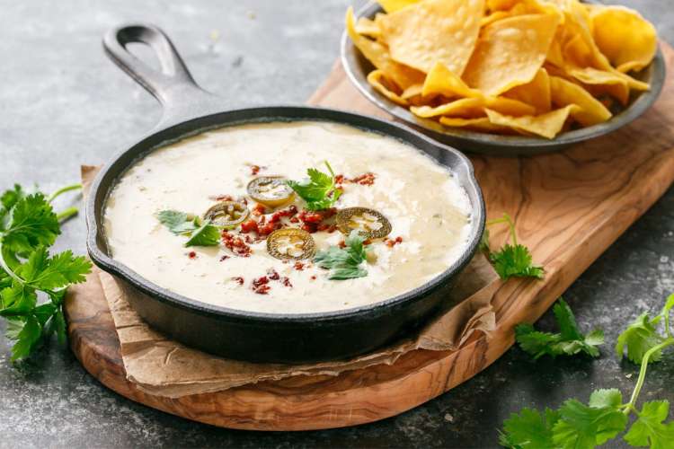 spicy chorizo queso dip is an indulgent white queso