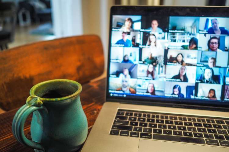 laptop with zoom gallery view during a virtual happy hour