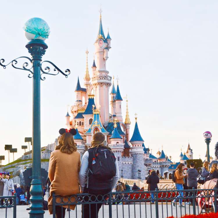 young couple spending a date night at disneyland