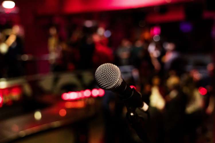 microphone on stage during a comedy show